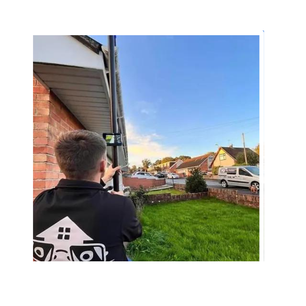 A man cleaning gutters for a customer.